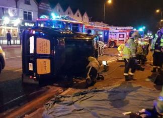 Taxi overturned in crash on Stratford Road Hall Green passenger thrown out of window
