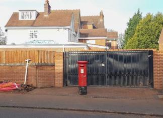 A Royal Mail post box placed in middle of driveway in Moseley