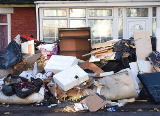 A Pile of Rubbish Making Residents Walk In The Road