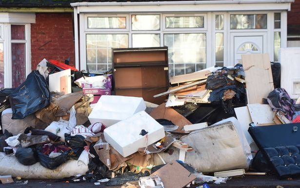 A Pile of Rubbish Making Residents Walk In The Road